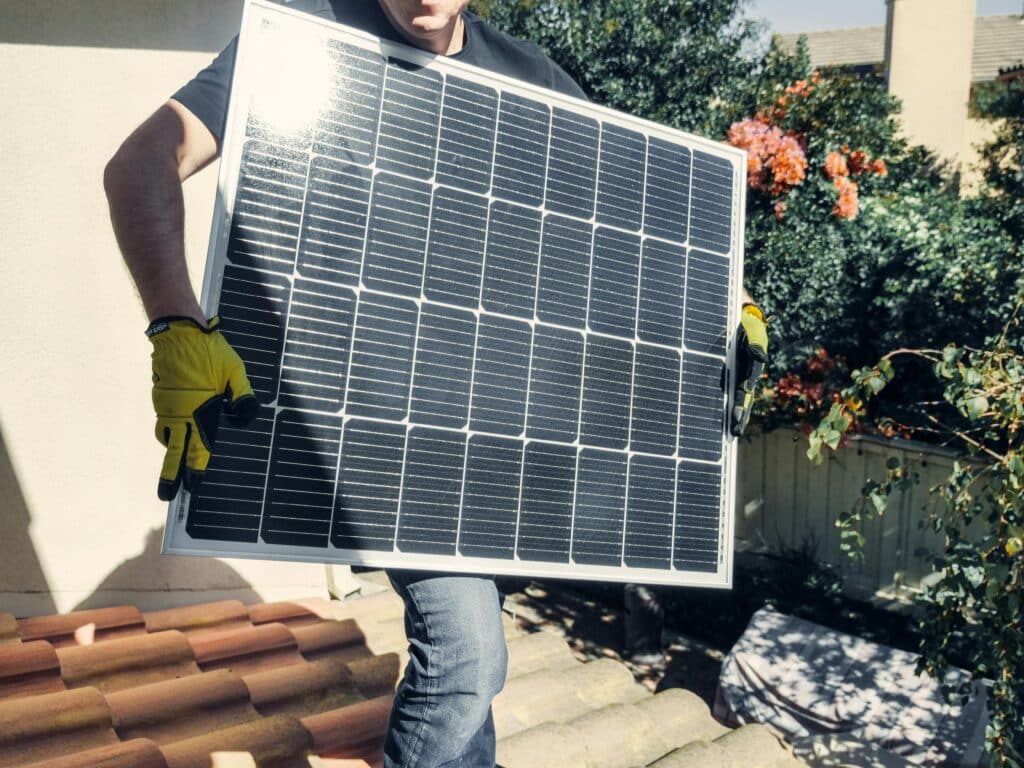 person installing solar panels person installing solar panels