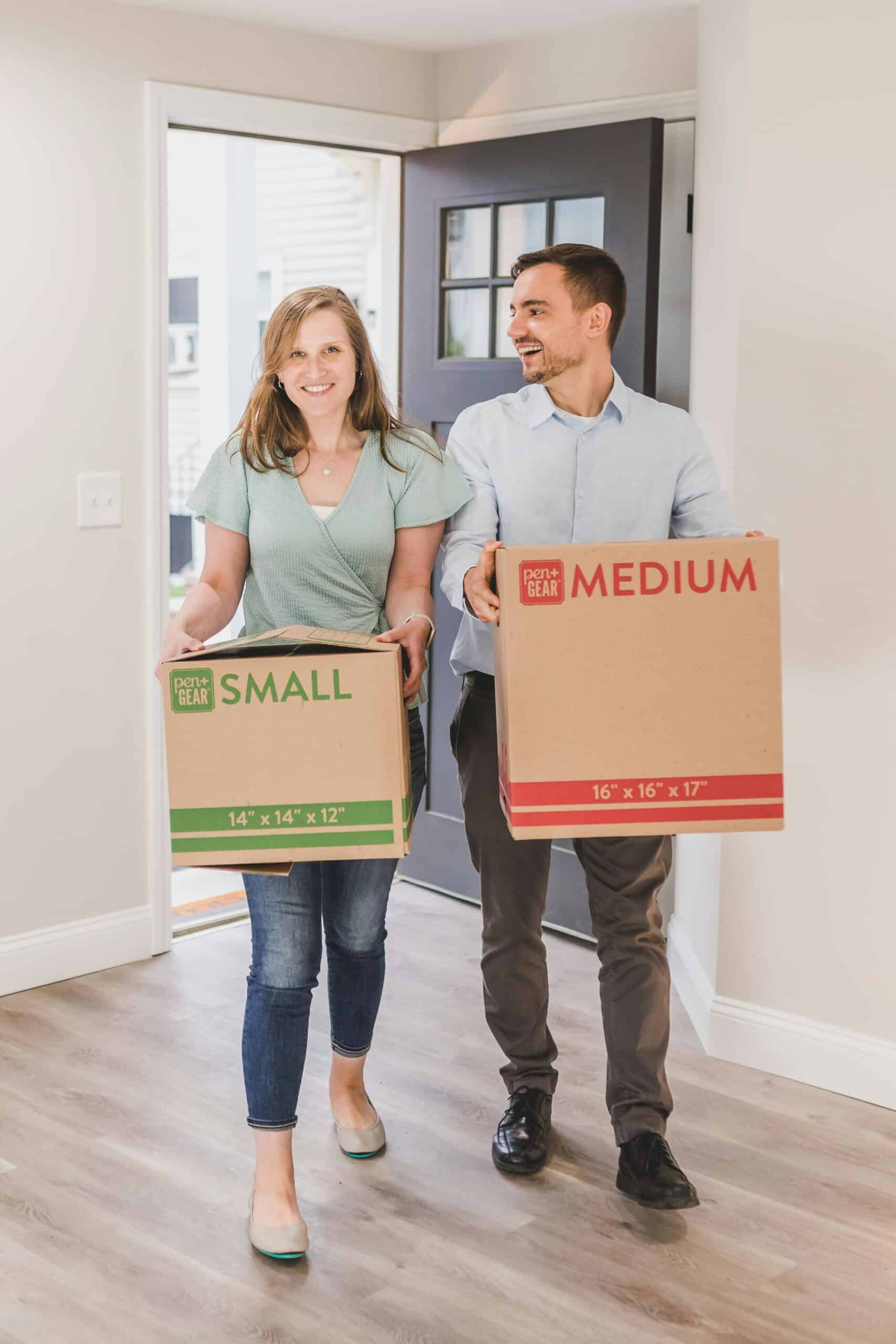 two people moving boxes